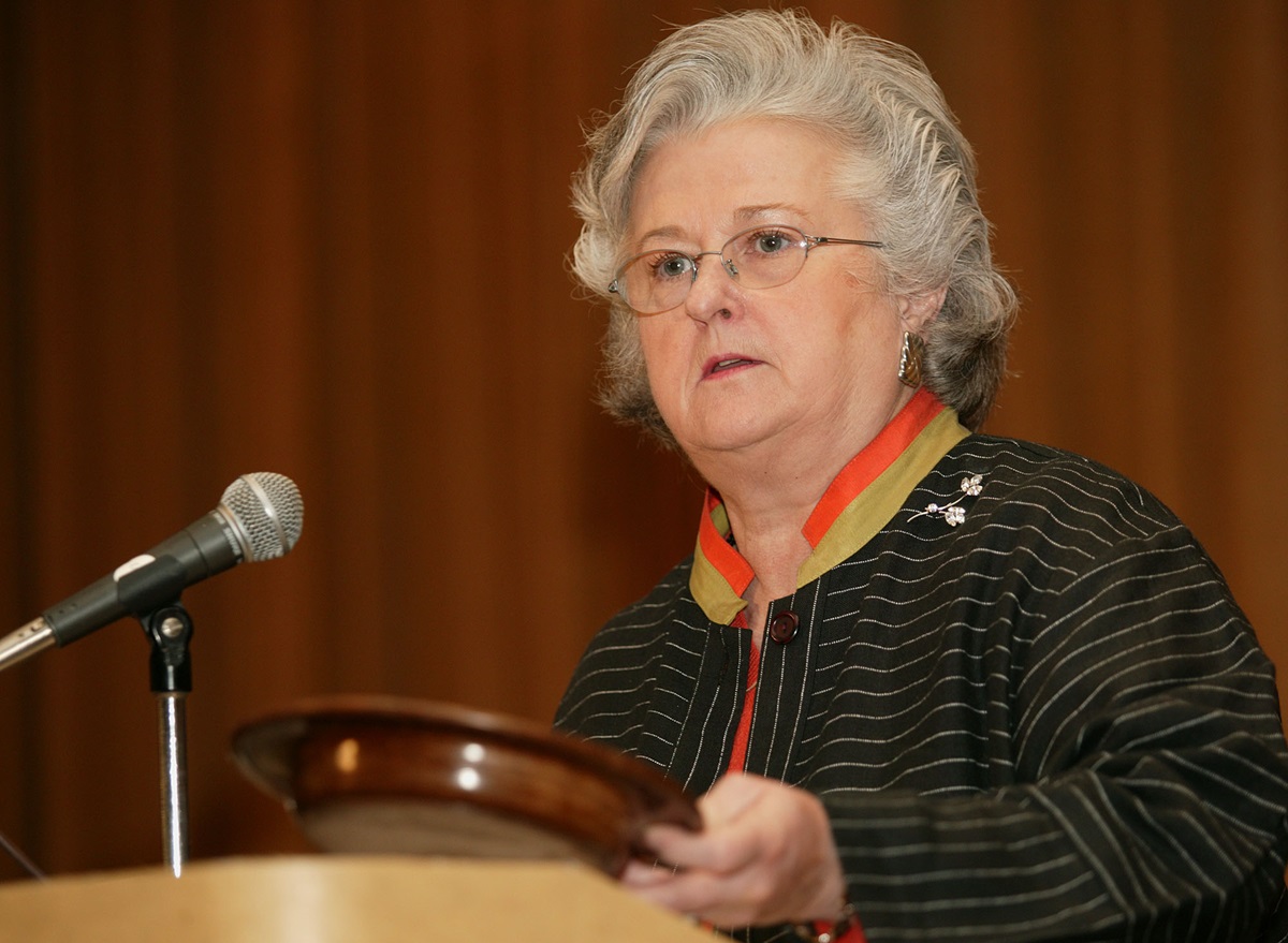 Sandra Kelley Lackore, holding a church offering plate, talks about financial stewardship during the Pre-General Conference News Briefing. UMNS photo by Mike DuBose