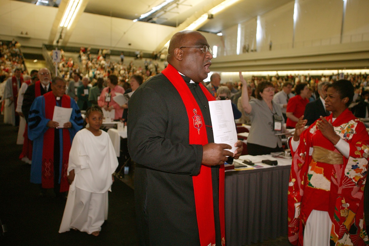 Bishop Gregory V. Palmer (center) joins the processional during the opening worship of the United Methodist Church's 2004 General Conference in Pittsburgh. The church's top legislative assembly is meeting April 27-May 7. Palmer leads the church's Iowa Area. A UMNS photo by Mike DuBo