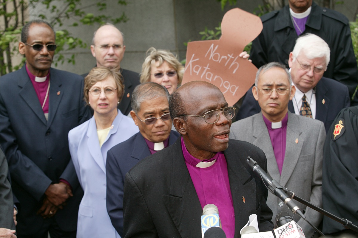 United Methodist Bishop Joseph Humper of Sierra Leone, flanked by a number of fellow bishops, speaks out about the U.S. government's denial of visas for some United Methodists from Africa and the Philippines during a press conference in front of Pittsburgh's federal building. A UMNS photo by Mike DuBose.
