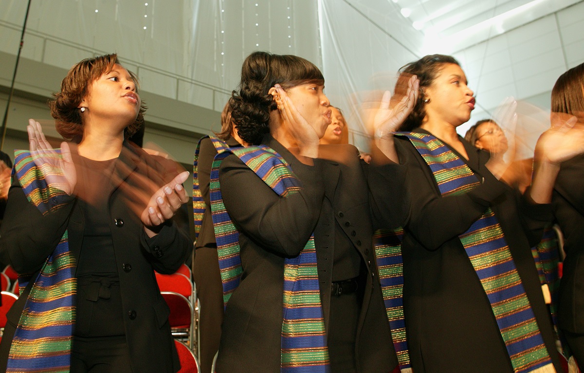 Choir members from St. James United Methodist Church, Alpharetta, Ga., sing and dance during Wednesday morning worship at the United Methodist General Conference in Pittsburgh. A UMNS photo by Mike DuBose.
