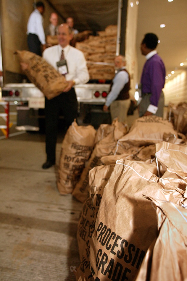 United Methodist bishops and other volunteers help unload 45,000 pounds of potatoes from a truck parked outside the David L. Lawrence Convention Center in Pittsburgh, site of the denomination's 2004 General Conference. The April 29 Potato Drop was sponsored the General Commission on United Methodist Men and the Society of St. Andrew and benefited hunger ministries in the Pittsburgh area. A UMNS photo by Mike DuBose.
