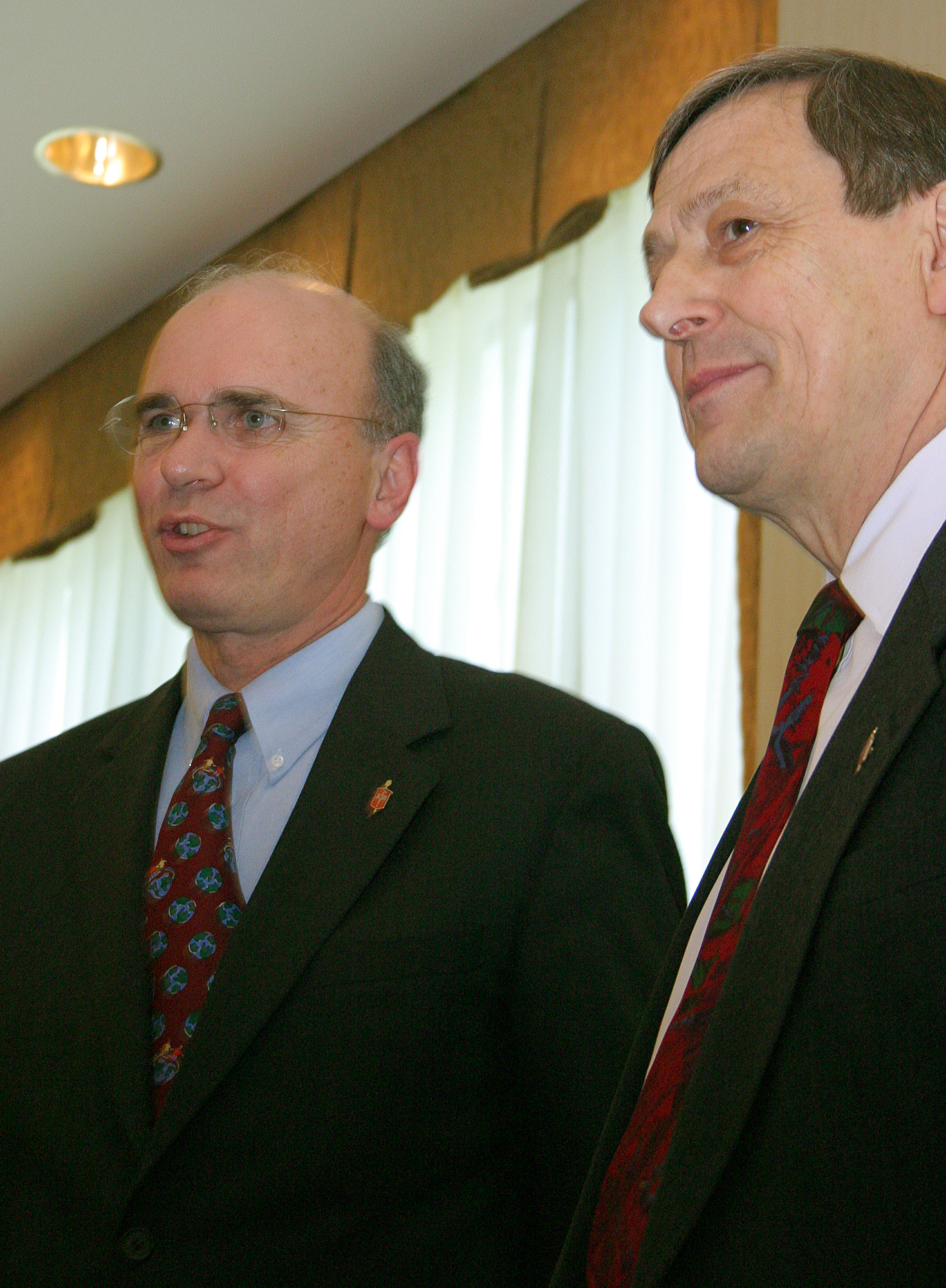 United Methodist Bishop Peter D. Weaver (left) is installed as president of the denomination's Council of Bishops, succeeding Bishop Ruediger R. Minor (right), Eurasia. The installation came during the 2004 General Conference in Pittsburgh. A UMNS photo by Rasul Welch.