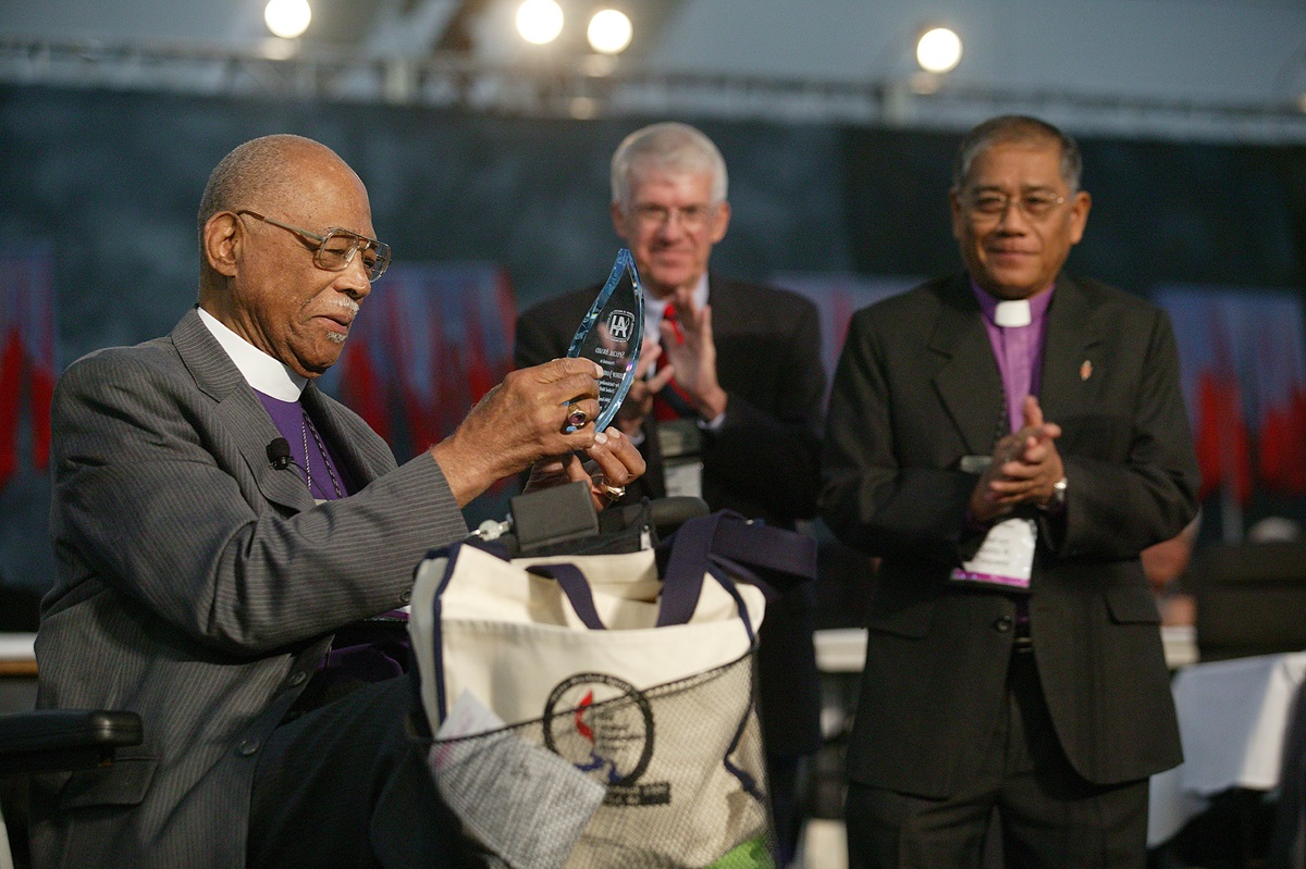 Bishop James S. Thomas (left) is honored by General Conference for the contributions he made dismantling the former Central Jurisdiction of the church. A UMNS photo by Mike DuBose.