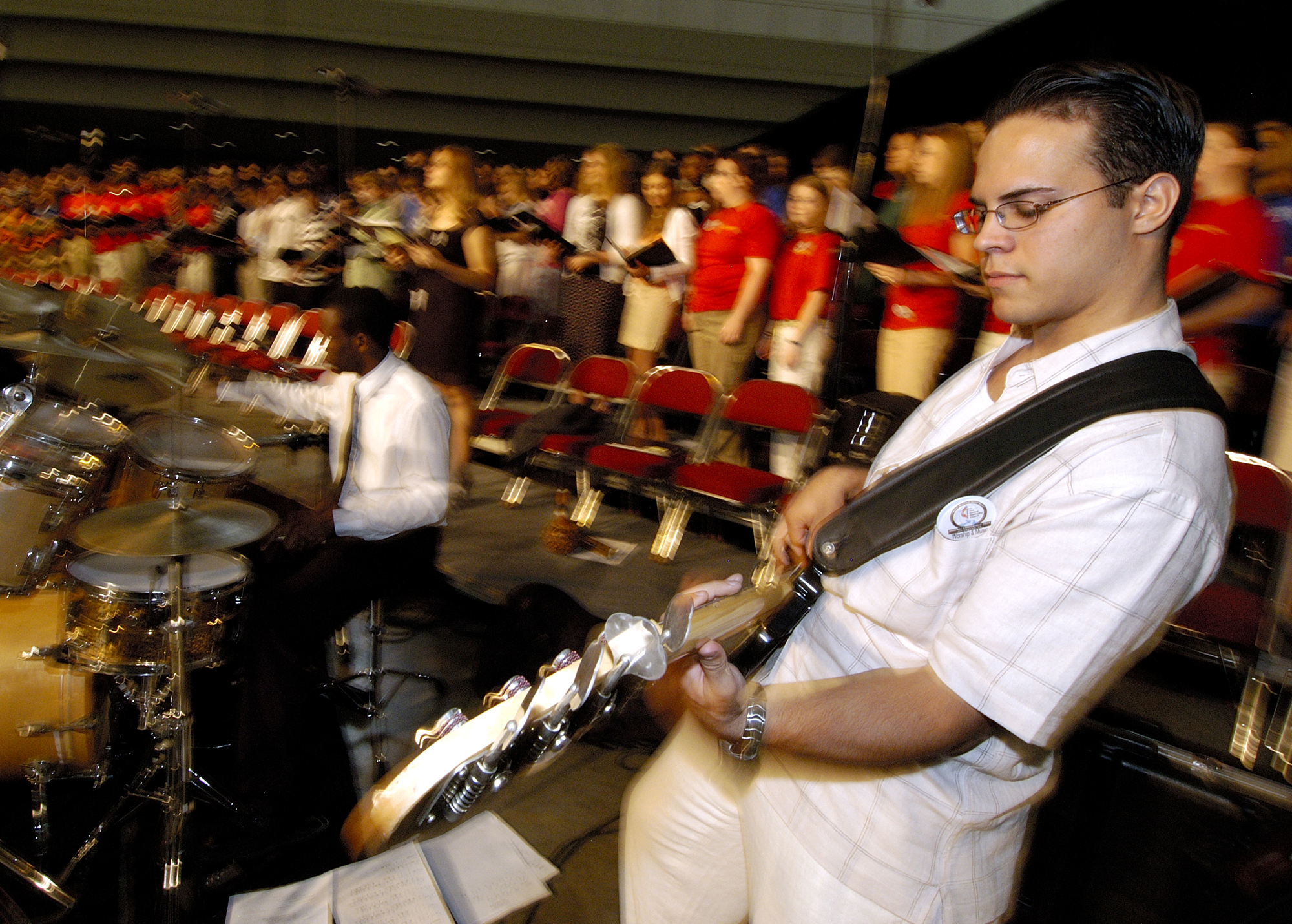Remy Dou, a guitarist with Drive, the Miami District Youth Band, performs during morning worship on May 1 at the 2004 United Methodist General Conference in Pittsburgh. A UMNS photo by Paul Jeffrey.
