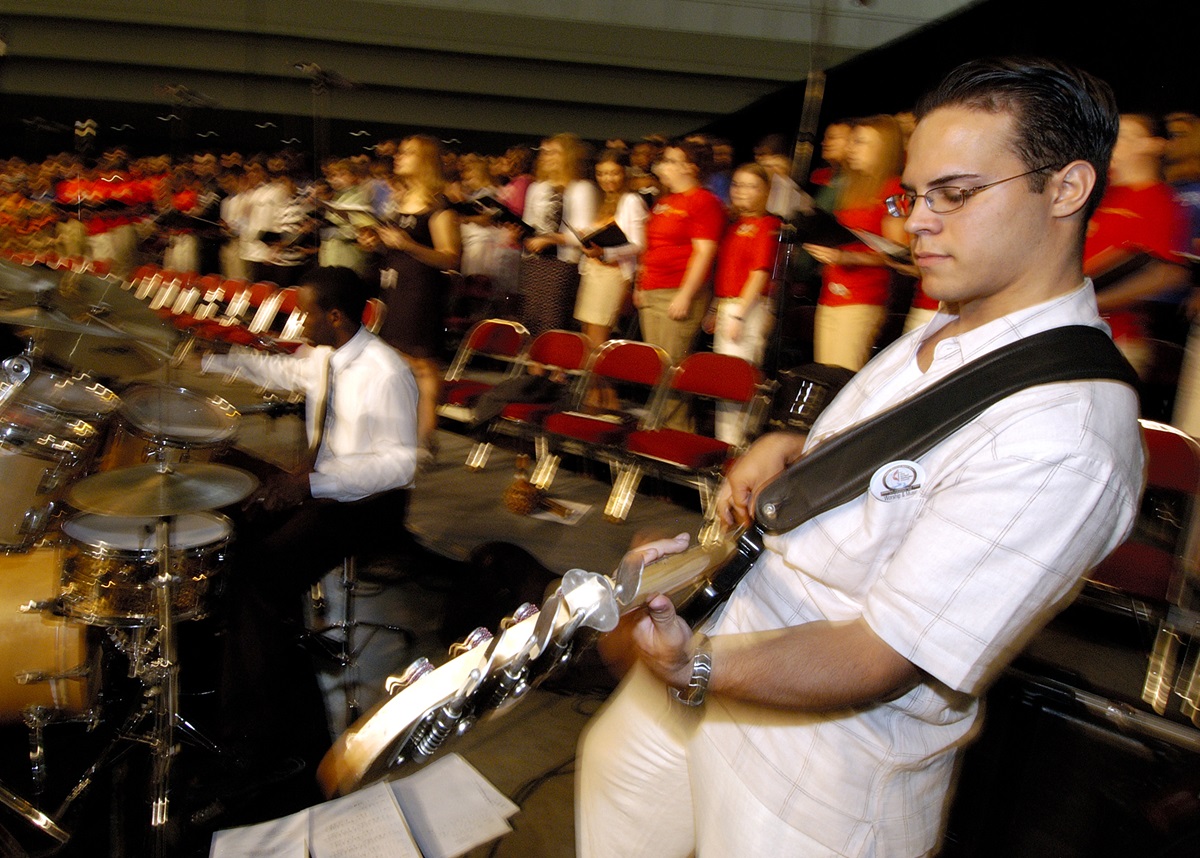 Remy Dou, a guitarist with Drive, the Miami District Youth Band, performs during morning worship on May 1 at the 2004 United Methodist General Conference in Pittsburgh. A UMNS photo by Paul Jeffrey.