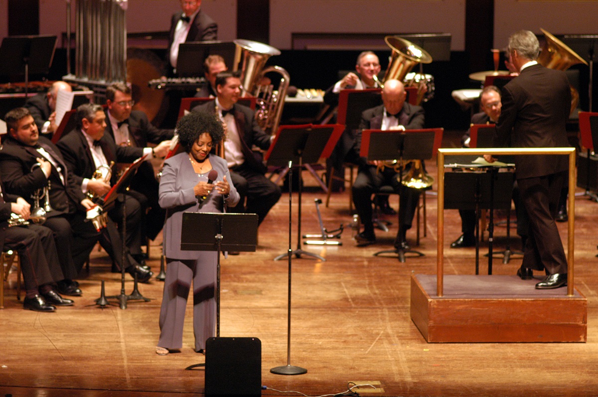 Jazz singer Etta Cox (left foreground) performs with the River City Brass Band during the Pittsburgh Area Night program at the Heinz Hall for the Performing Arts. Pittsburgh is host to the United Methodist Church's 2004 General Conference April 27 - May 7. A UMNS photo by John C. Goodwin.