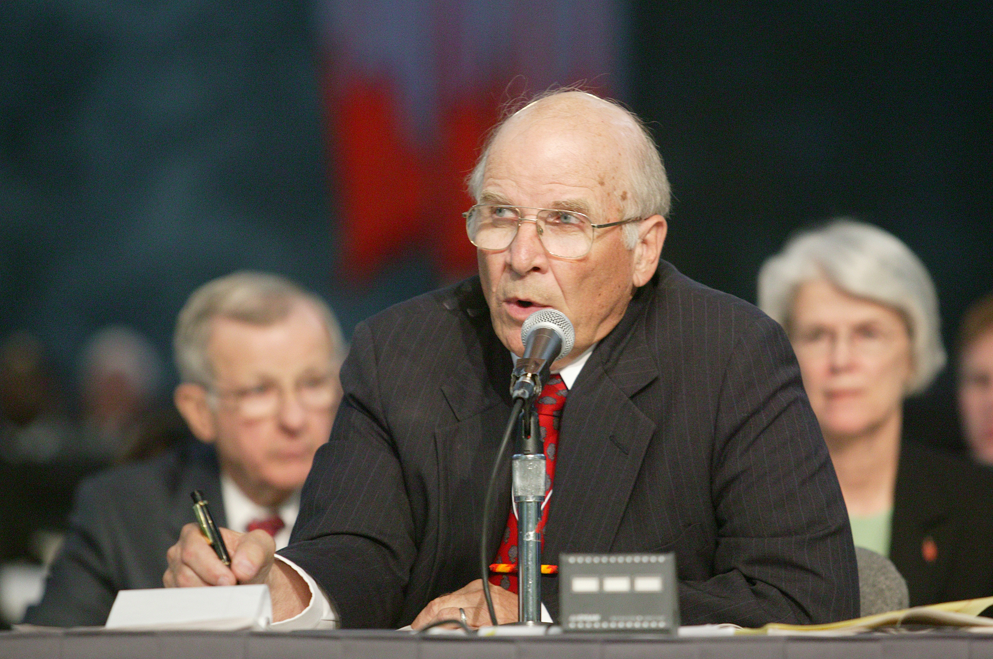 United Methodist Bishop Bruce P. Blake (center), Oklahoma Area, flanked by bishops Joe E. Pennel, Jr., Virginia Area, and Sharon Brown Christopher, Illinois Area, presides over a session of the denomination's 2004 General Conference in Pittsburgh where delegates voted to maintain language in the church's Book of Discipline that the practice of homosexuality is "incompatible with Christian teaching." A UMNS photo by Mike DuBose.