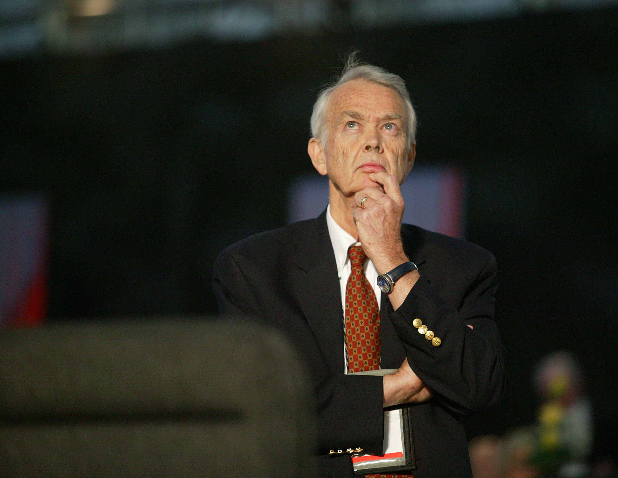 The Rev. H. Eddie Fox, Holston, watches vote totals on May 4 as the 2004 General Conference maintains language in the United Methodist Church's Book of Discipline that the practice of homosexuality is "incompatible with Christian teaching." Fox presented the minority report from the Church and Society Legislative Committee that was adopted by the delegates. A UMNS photo by Mike DuBose.