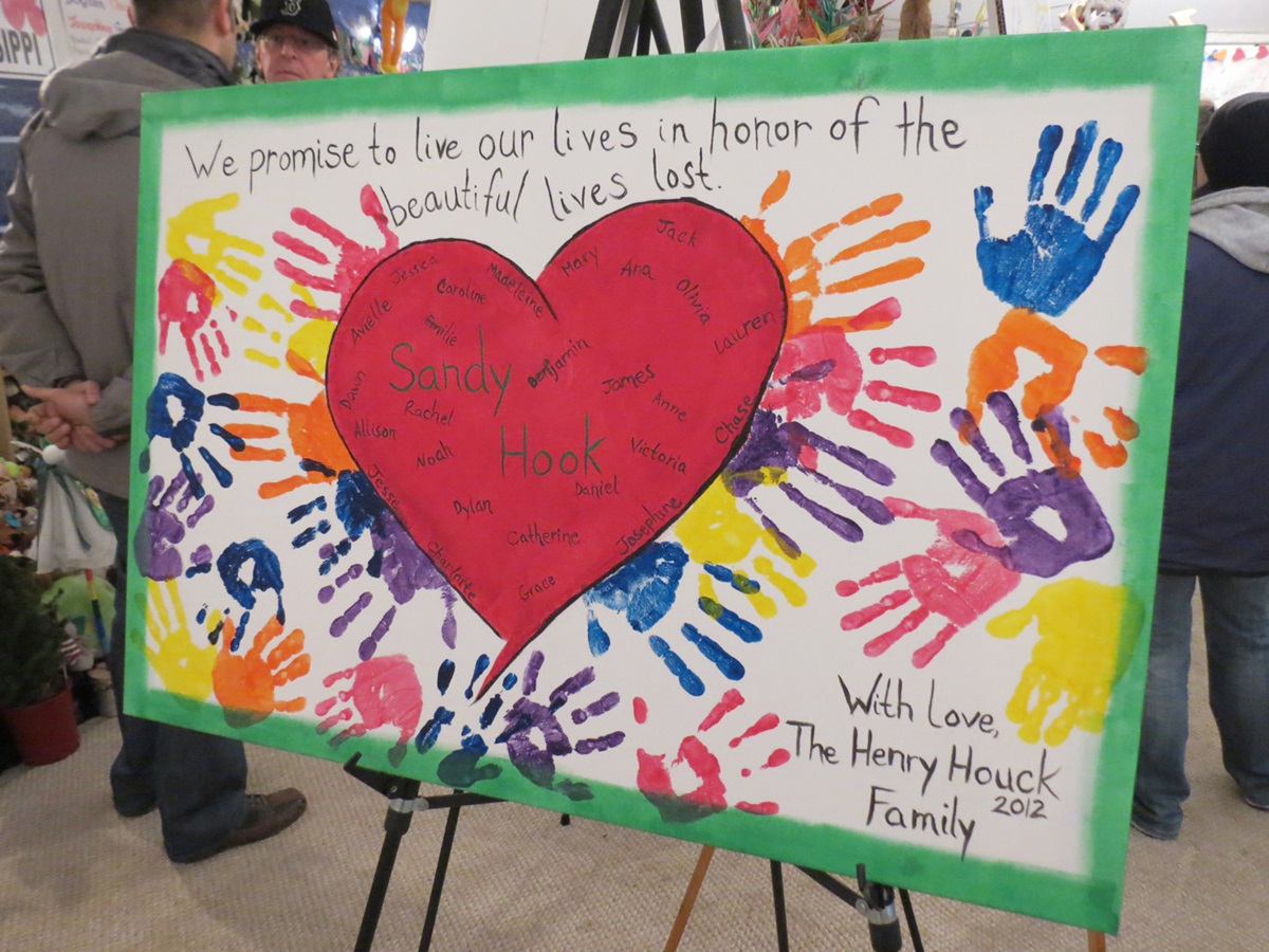 One of many signs of support at a tent memorial center near the Sandy Hook Elementary School in Newtown, Conn.