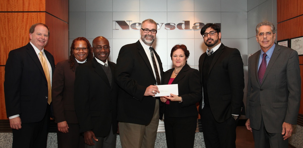UMCOR’s Rev. Tom Hazelwood (center) receives a check from Dale Cole, Community Affairs project manager for Newsday. They are flanked by, from left to right, Bill Kohl, Communities Program director, McCormick Foundation; Rev. Adrienne Brewington, Long Island East District Superintendent; Rev. Joseph Ewoodzie, New York Annual Conference Disaster Response coordinator; Kashif Shaikh, program officer, McCormick Foundation; and Paul Fleishman, vice president Public Affairs, Newsday.
Courtesy of Newsday
