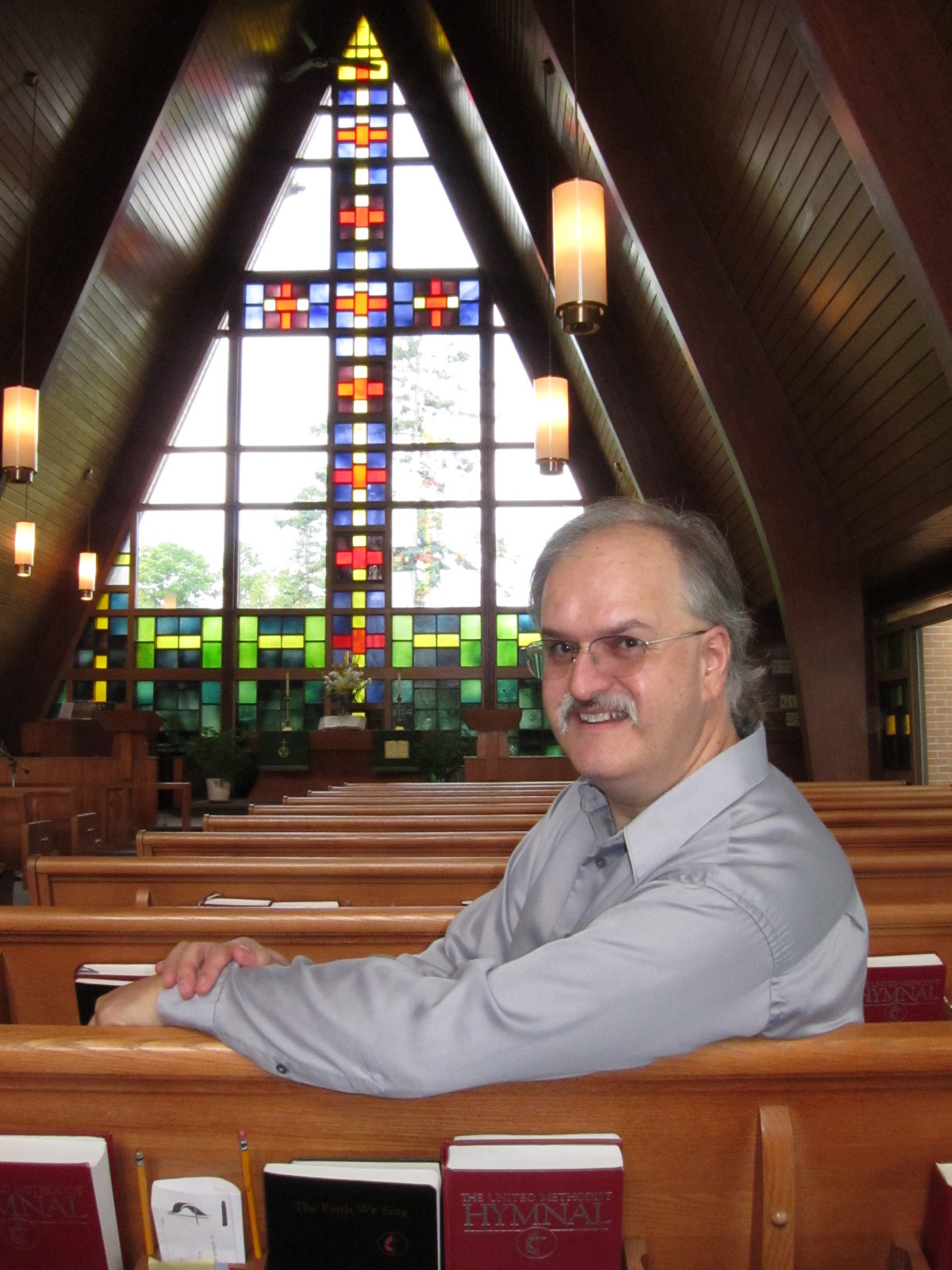 The Rev. Erik Alsgaard inside St. Ignace United Methodist Church in St. Ignace, Michigan. A UMNS photo by Kathleen Barry.