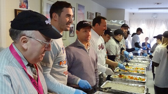 Photo by Adam Rubin | ESPNNewYork.com
Jay Horwitz, Matt Harvey, Jeff Wilpon and Dave Howard were among the Mets employees on hand serving hot meals at the United Methodist Center in Far Rockaway on Tuesday. The soup kitchen feeds the area needy throughout the year, in part through unsold food delivered from Citi Field after games.