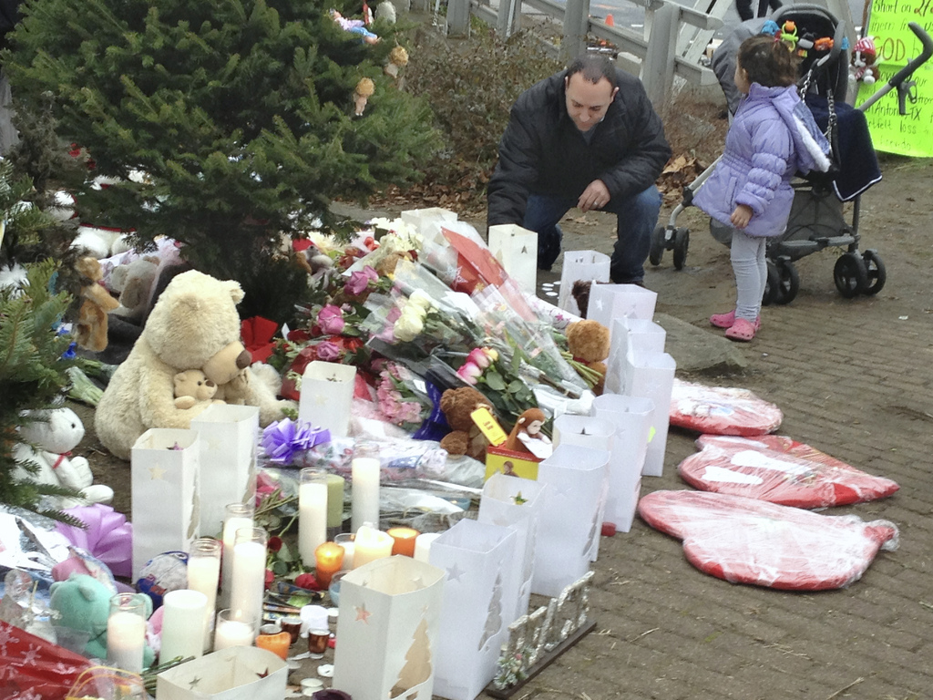 Memorial of candles, flowers, stuffed animals, and cards for the children and 6 adults who died at the Sandy Hook Elementary School in Newtown, Connecticut on December 14, 2012. An IAUMC photo by Arthur McClanahan