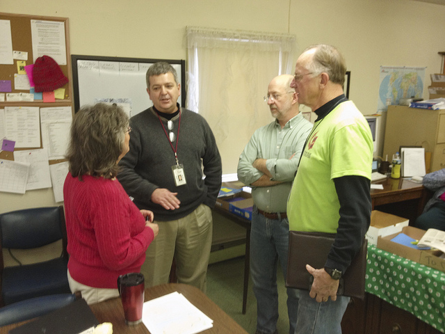 Peggy Racine, program and volunteer coordinator for the United Methodist Disaster Relief Center in Massapequa, N. Y.; Greg Forester, Northeast coordinator for Volunteers in Mission, the Rev. Jeff Wells of Community United Methodist Church in Massapequa, and Warren Ferry, a work team leader, discuss volunteer coordination.