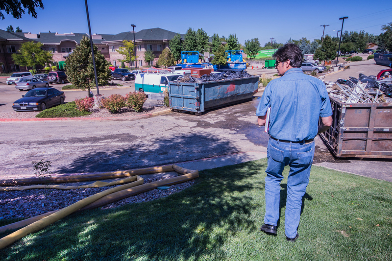 The Rev. Gary Haddock assesses flood damage at Frasier Meadows, a United Methodist-related Health Care Center in Boulder, Colo. A UMNS photo by Christi Turner.