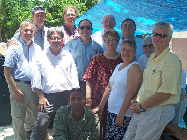 A volunteer team of United Methodists, led by Greg Forrester (top left), and a Haitian interpreter worked May 10-17 in Mellier, Haiti.