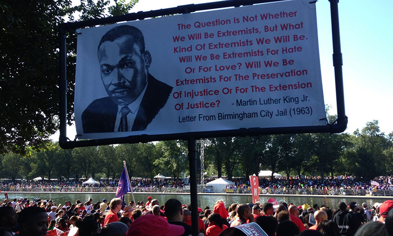 A banner commemorating the Rev. Martin Luther King Jr. flies above the National Mall in Washington during the 50th anniversary celebration of King’s “I Have a Dream” speech. 