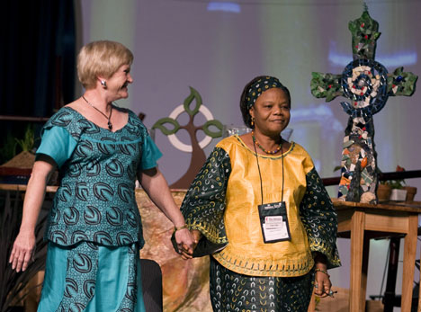 Marilyn Griffith of St. Luke’s United Methodist Church in Indianapolis dances with Janet Yema Bio, a midwife at the United Methodist-related Kissy Hospital in Sierra Leone, during a presentation on The Advance, a program of designated giving through The United Methodist Church. 