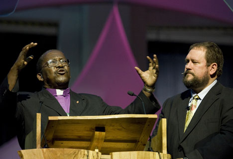 Bishop João Somane Machado of Mozambique (left) preaches during morning worship on April 25 at the United Methodist General Conference in Fort Worth, Texas. Translating is Donald Reasoner of the church's Board of Global Ministries. 