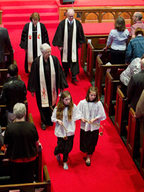 Clergy follow the acolytes out of the sanctuary after worship. Bishop Debra Wallace-Padgett, who gave the sermon, is at left rear. She is flanked by the Revs. Bob Alford (right) and Jeri Hunt.