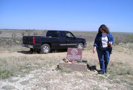 The Rev. Carol Lakota Eastin views the marker at the Sand Creek Massacre National Historic Site near Chivington, Colo. A UMNS photo by Eliida Lakota.