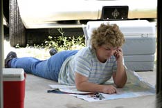 The Rev. Marilyn Roeder spreads out a map to give directions to a team member driving to New Orleans from Victoria, Texas. A UMNS photo by Kathy L. Gilbert.