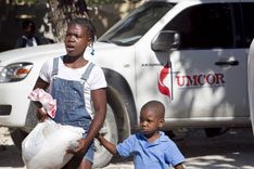 Recipients leave an UMCOR aid distribution in Mellier, Haiti.