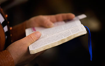 A parishioner reads her Bible at Chongwenmen Church in Beijing, China. Chinese Bible production, which was halted during the Cultural Revolution, began again in the 1980s with a prototype taken from old Bibles that had not been confiscated by the Red Guards.