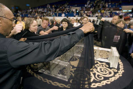 Supporters of full inclusion for gays and lesbians in The United Methodist Church drape the central table in black cloth during a demonstration on the floor of the 2008 United Methodist General Conference in Fort Worth, Texas. 