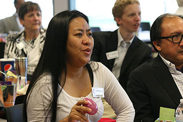 Riva Ruth Tabelisma, a Connectional Table member from the Philippines, joins in morning worship at the Connectional Table meeting May 1, 2013 in Chicago. A UMNS photo by Heather Hahn.