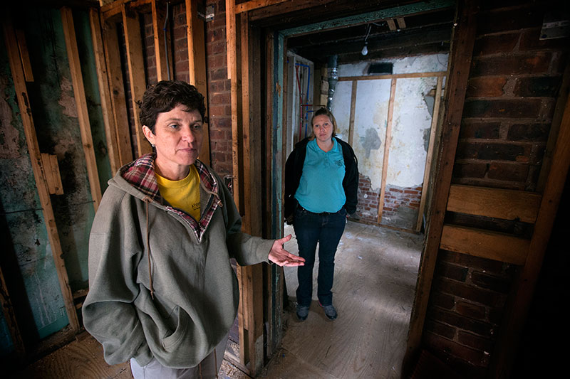 Bobbie Ridgely (left) and Katie Quigley discuss the progress of repairs at a home damaged by Hurricane Sandy in Atlantic City, N.J. They work for A Future With Hope, a long-term recovery program of the Greater New Jersey Conference of The United Methodist Church.