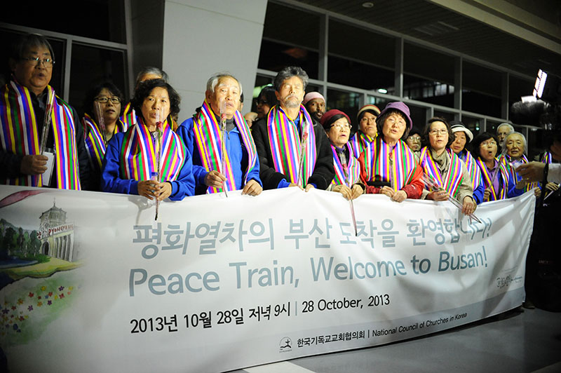 Peace train arriving to Busan. The travelers gathered in prayer for peace. Joanna Linden-Montes/WCC