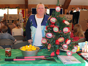 At Huntington United Methodist Church, Shelton, Conn., member Diane Walsh greets visitors during the 2009 alternative fair. File photo courtesy of Huntington UMC, Shelton, Conn.