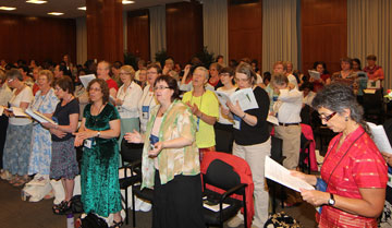 Roseangela Oliveira (right) joins with other participants in the World Day of Prayer international gathering at the Interchurch Center in New York.