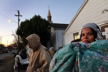 In the early hours of dawn, Tagawunia Tarleton waits outside Sixty-First Avenue United Methodist Church in Nashville to receive a ticket to shop for her nine children at the Last-Minute Toy Store. A UMNS photo by Kathleen Barry.