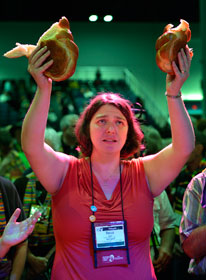 The Rev. Becca Clark participates in communion May 3 during the 2012 General Conference as part of a protest demanding a more inclusive church. A UMNS photo by Paul Jeffrey.