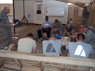 Chaplain John Branning leads a service of Holy Communion following a mortar attack in Taji, Iraq. A UMNS photo courtesy of Chaplain John Branning.