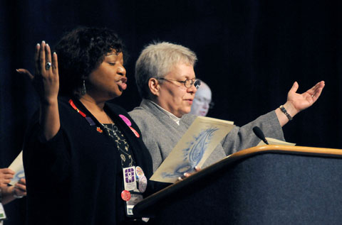 Garlinda Burton (left) and Kim Coffing lead a worship service at the 2008 United Methodist General Conference in Fort Worth, Texas. A UMNS photo by John C. Goodwin.