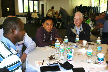 Baguio (Philippines) Area Bishop Rodolfo Alfonso Juan (center) and retired Bishop Robert H. Spain (right) share in a discussion about proposals for implementing the Call to Action recommendations.