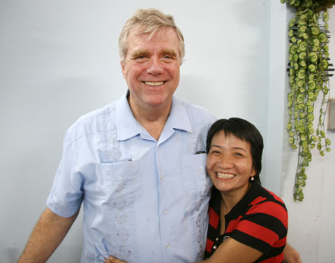 The Rev. Clinton Rabb shares a hug with a church member during worship in Ho Chi Minh City, Vietnam, in September 2008. A UMNS photo by Adam Neal, GBGM.