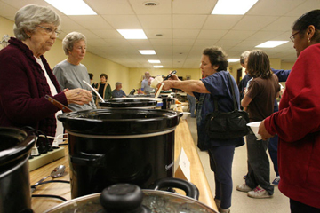Rome, Ga.'s Chapel Hill United Methodist Church members Billie Dixon (left) and Barbara Dixon offer homemade soup to Susan Cox, whose home was lost in the Feb. 29 tornado. A web-only photo by Lauren Jones/Rome News-Tribune.