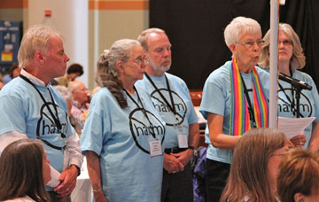 Members of the Iowa Annual (regional) Conference  wear shirts 