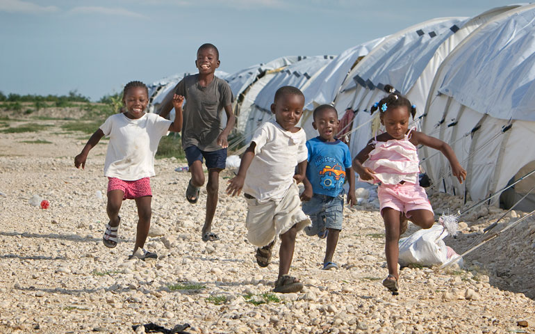 Children play between rows of tents at Camp Corail where the United Methodist Committee on Relief is helping provide services. 