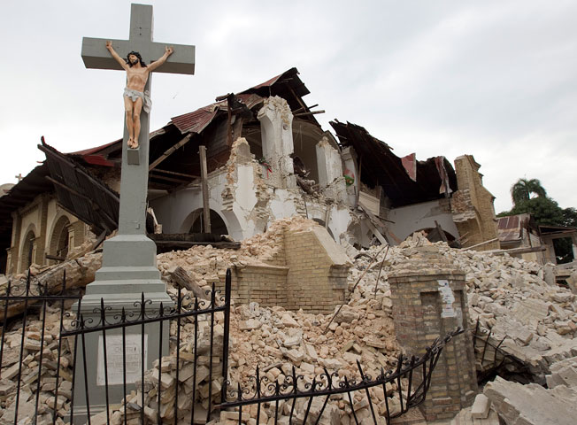 A crucifix stands amid the rubble of Sacred Heart Catholic Church in Port-au-Prince, Haiti.