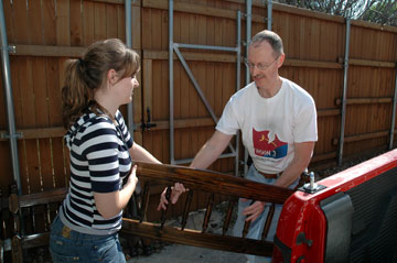 Tom Hutson and his daughter, Amy, load a donated headboard for delivery through the Custer Road United Methodist Church's Head Start Bed Start ministry.  Head Start serves 3-year-olds and 4-year olds whose families are living in poverty.  A UMNS photo by John Gordon.