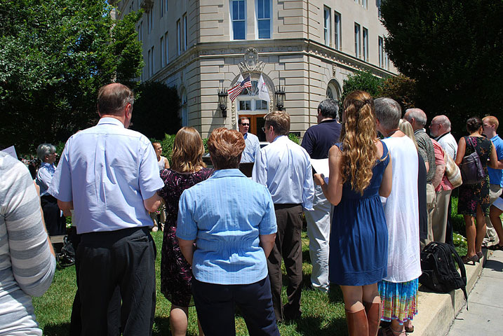 Jim Winkler leads a prayer vigil for a "faithful budget" in front of The United Methodist Building in Washington. Photo by Wayne Rhodes, GBCS.