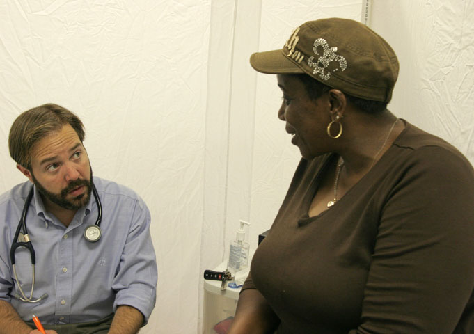 Sharon Young talks with Dr. Brent Wallas at Luke's House, a free medical clinic held every Tuesday evening in Mount Zion United Methodist Church.  UMNS photos by Kathy L. Gilbert.