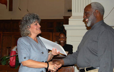 Ruth Jones (center) announces Laura Duarte valedictorian of 2009’s Class 16 as the Rev. William H. Robinson, executive director of Better Community Development Inc., presents her with a certificate of completion. Web-only photos courtesy of Better Community Development Inc., Little Rock, Ark. 