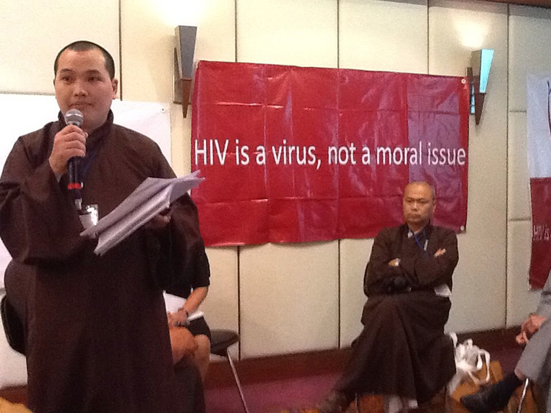 Buddhist monks share the message during Bangkok gatherings on AIDS in Asia and the Pacific. UMNS Photo by Donald Messer.