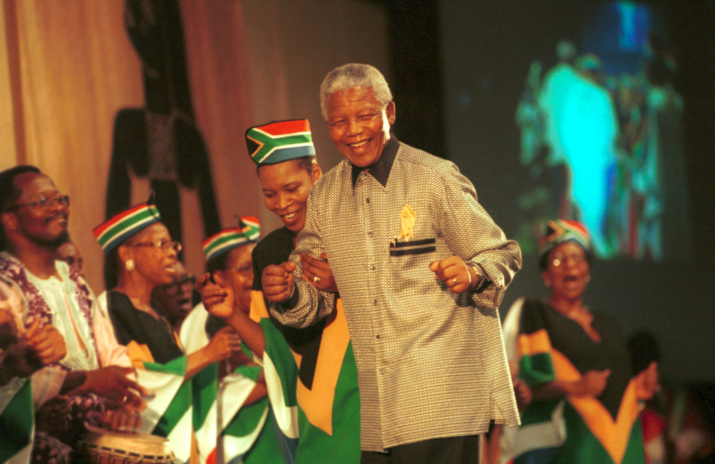 Mandela is greeted at the 8th assembly of the World Council of Churches in Harare, Zimbabwe, in December 1998. “Journey to Jubilee”: South African Choir Photo by Chris Black/WCC.